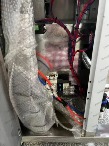 Packing machine with spare parts